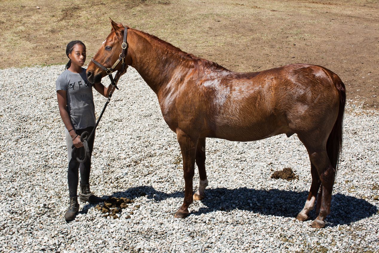 Young female equestrian with her horse, Ilona Szwarc, Los Angeles editorial photographer. 
