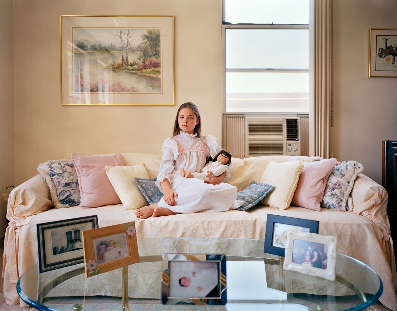 Young girl and her lookalike girl sitting in a bright living room, environmental portrait photography, Ilona Szwarc, contemporary Los Angeles artist.