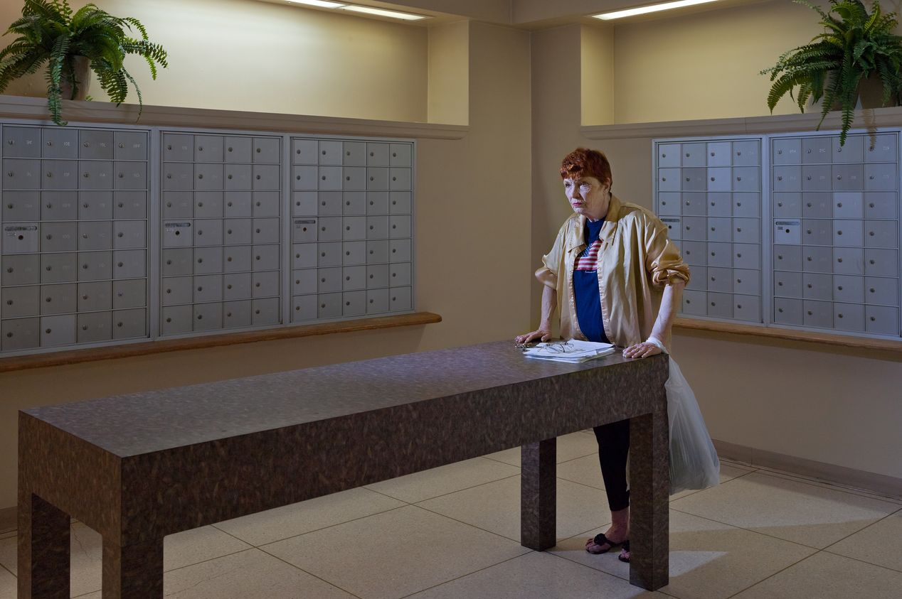 Old woman standing in a mailroom, editorial photography, Ilona Szwarc, Los Angeles portrait photographer.