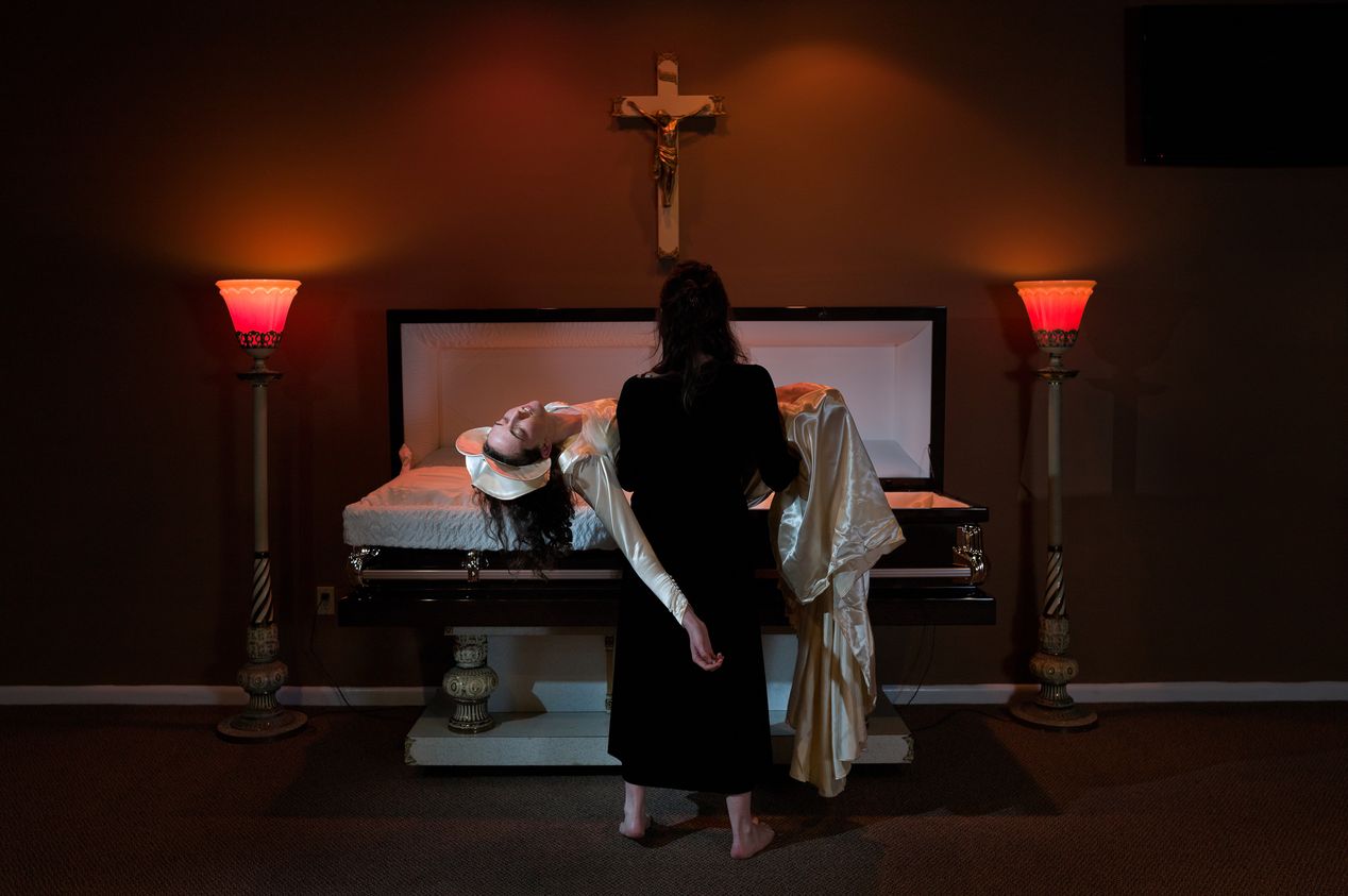 A woman holding another woman by the casket, editorial portrait photography, Ilona Szwarc, Los Angeles.