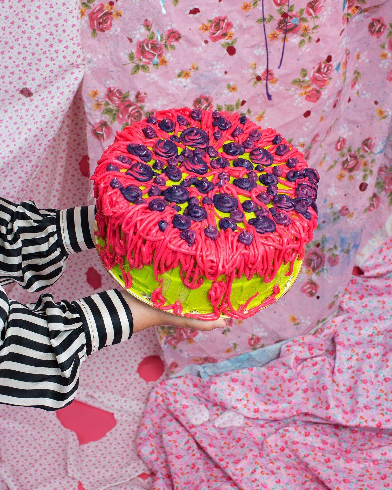 Detail of a girl holding a bright pink cake,Ilona Szwarc, best studio portrait photographer Los Angeles. 
