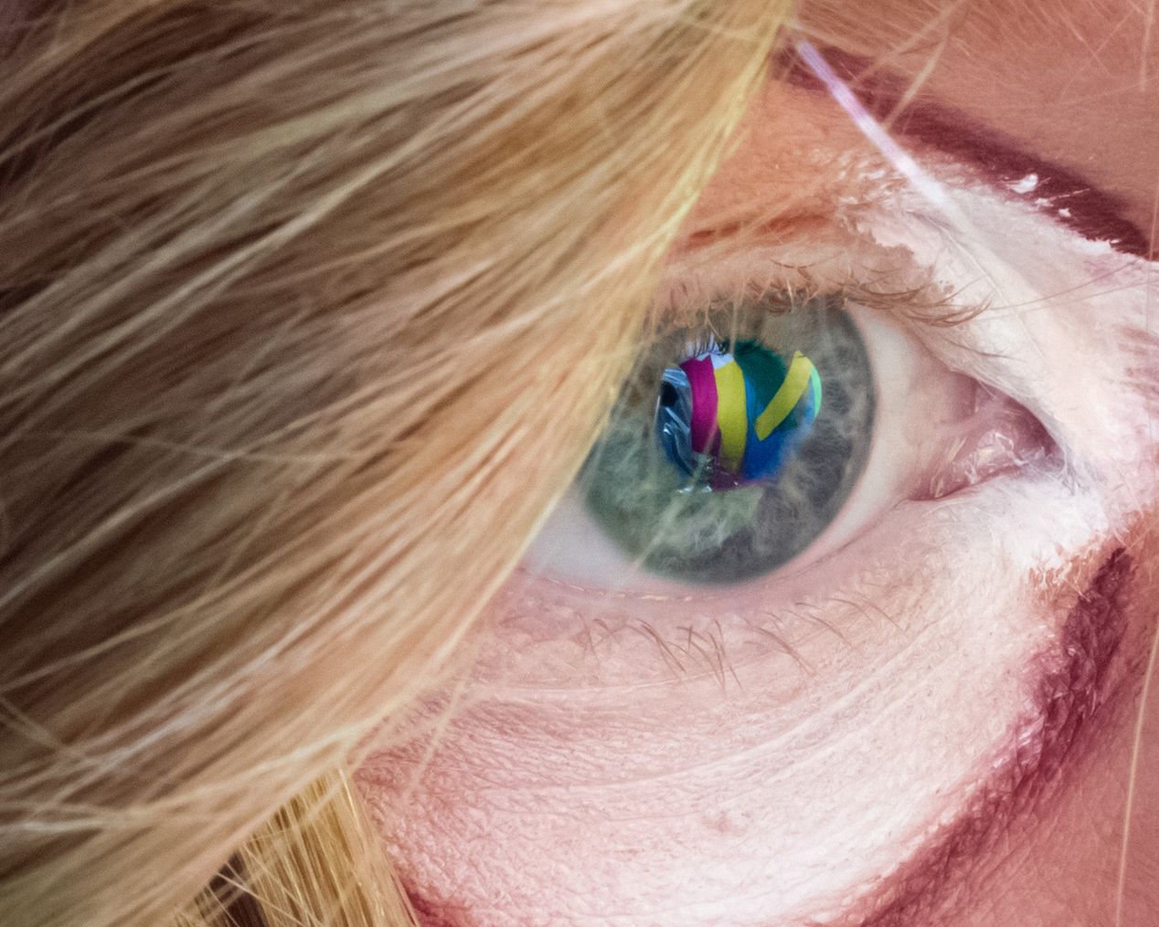 Closeup of an eye reflecting different colors, art photography, Ilona Szwarc, contemporary Los Angeles artist.