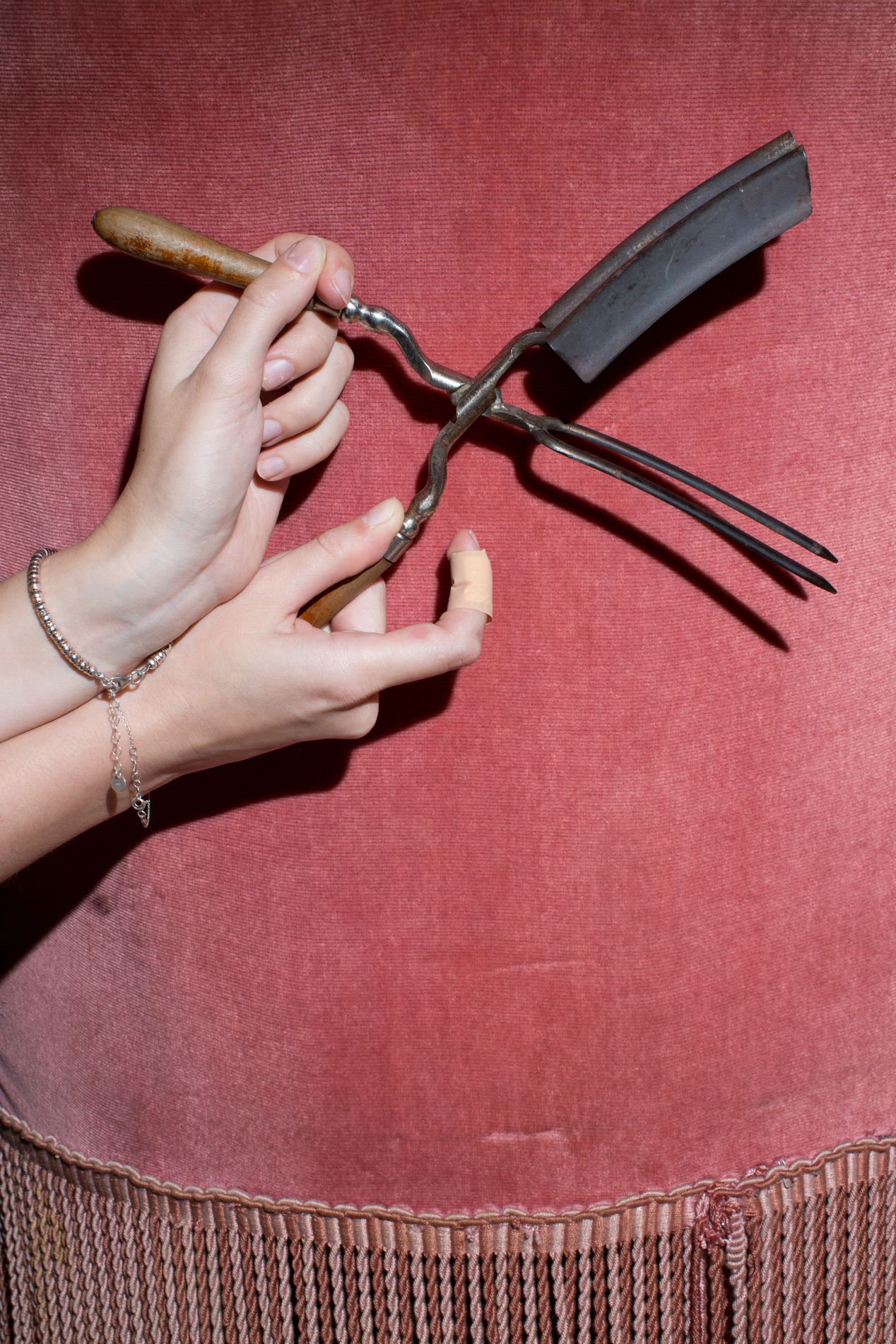 Female hands holding old, historic hair tool, fine art photography, Ilona Szwarc, contemporary Los Angeles artist.