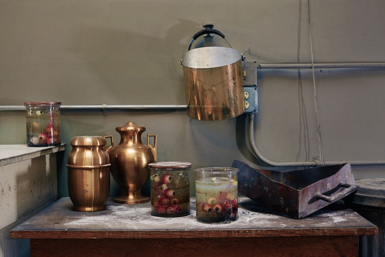 Still life with urns and jars filled with eyeballs in formaldehyde, staged photography, Ilona Szwarc, Los Angeles editorial photographer.