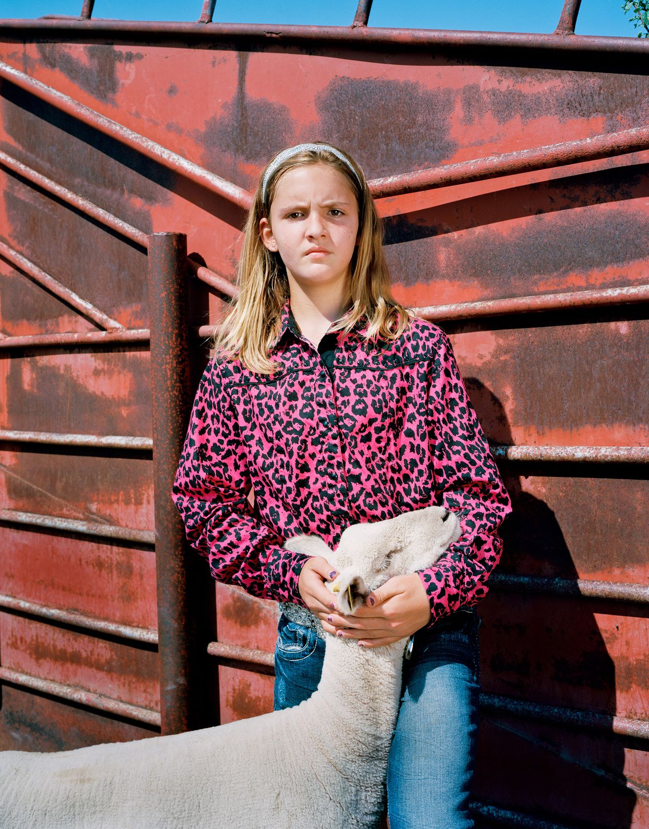 Young cowgirl with her show sheep, environmental portrait photography, Ilona Szwarc, contemporary Los Angeles artist.