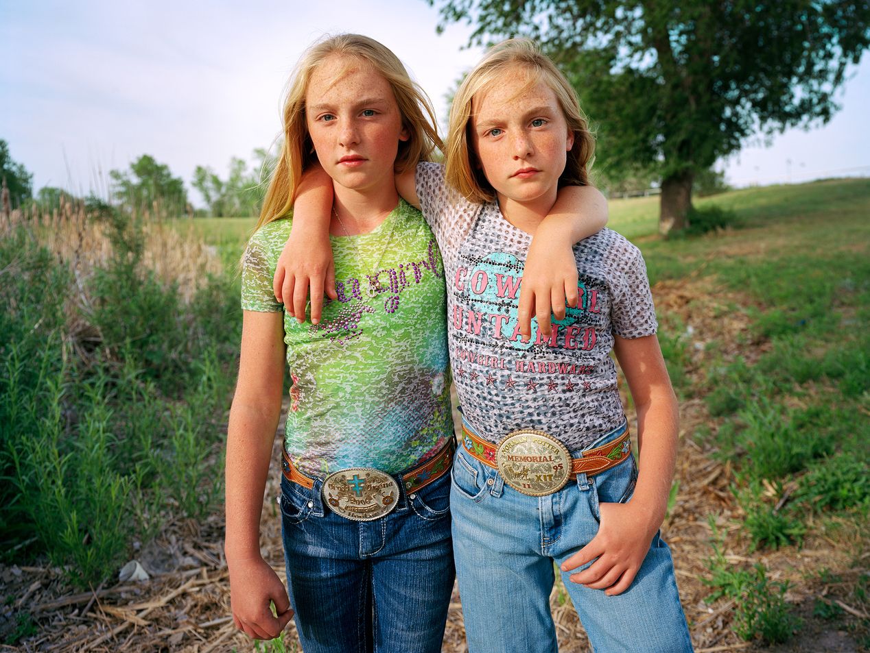 Twin sisters holding each other, environmental portrait photography, Ilona Szwarc, contemporary Los Angeles artist.