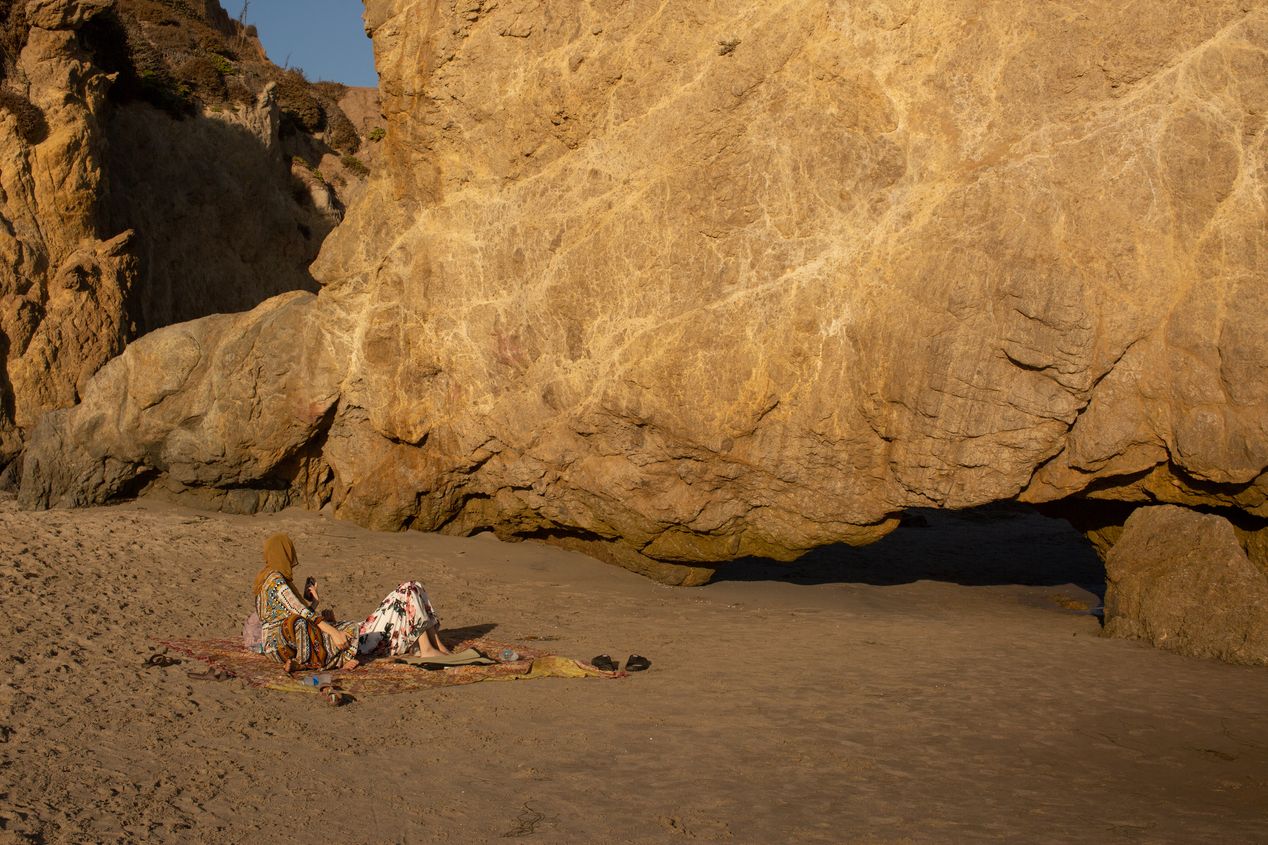 Two women on El Matador beach in Malibu, Ilona Szwarc, Los Angeles editorial photographer.