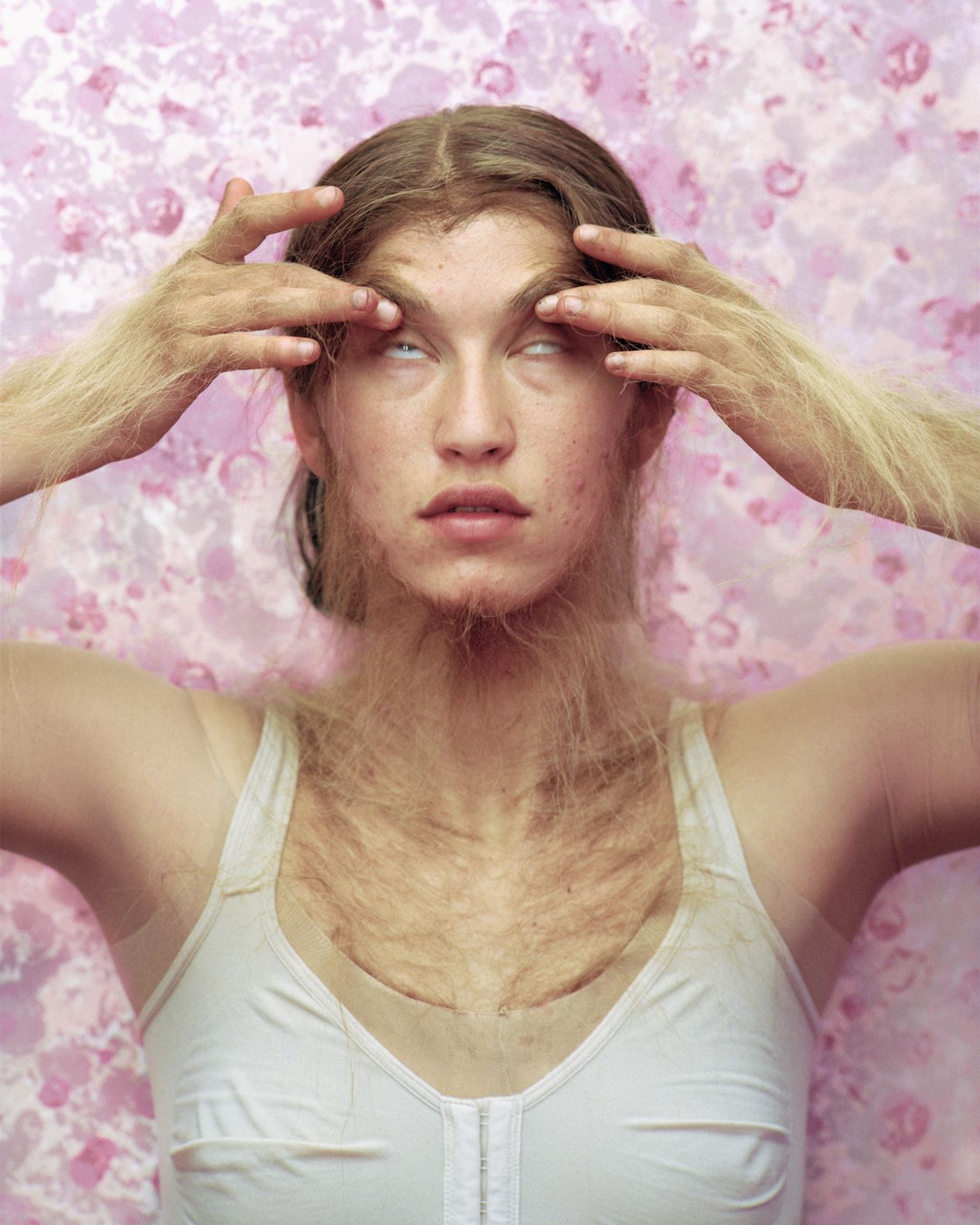 A young woman pulling on her eyelids with he furry hands, art photography, Ilona Szwarc, contemporary Los Angeles artist.