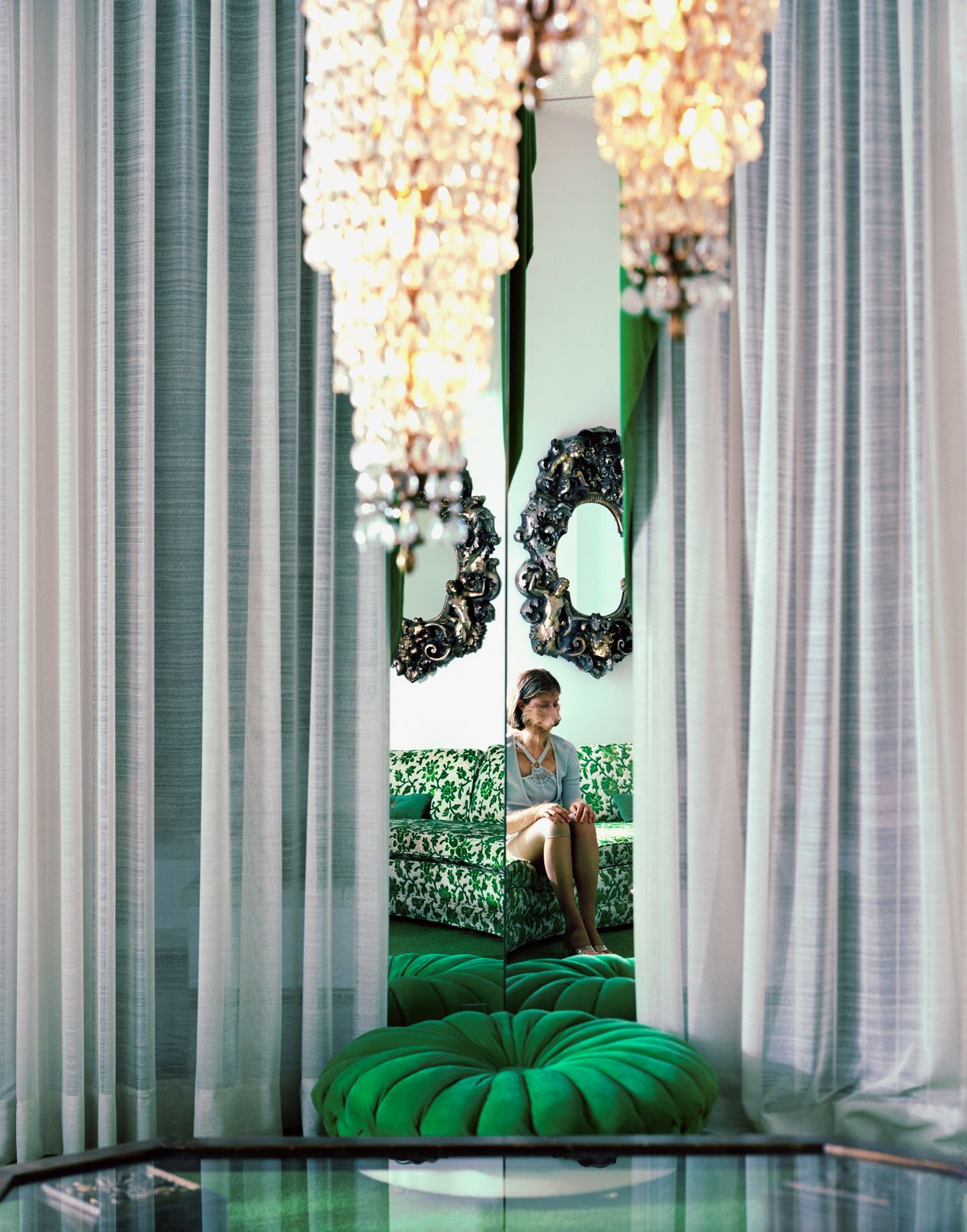 Reflection of part woman, part dog figure sitting on a patterned, green couch, art photography,art photography, Ilona Szwarc, contemporary Los Angeles artist.