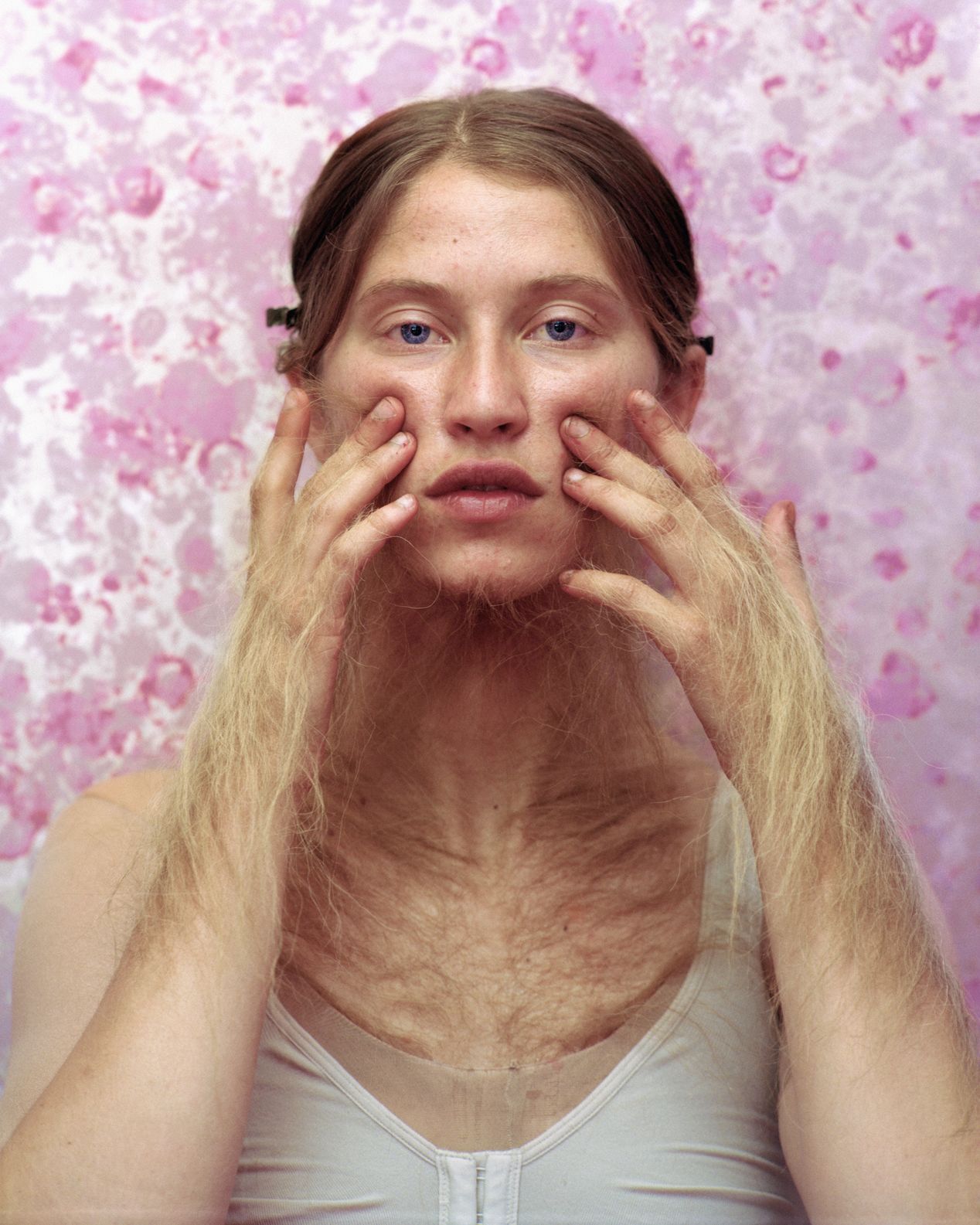A young woman touching her cheeks with furry hands, art photography, Ilona Szwarc, contemporary Los Angeles artist.